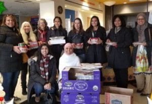 Muslim and Jewish women gathered and carrying baked goods