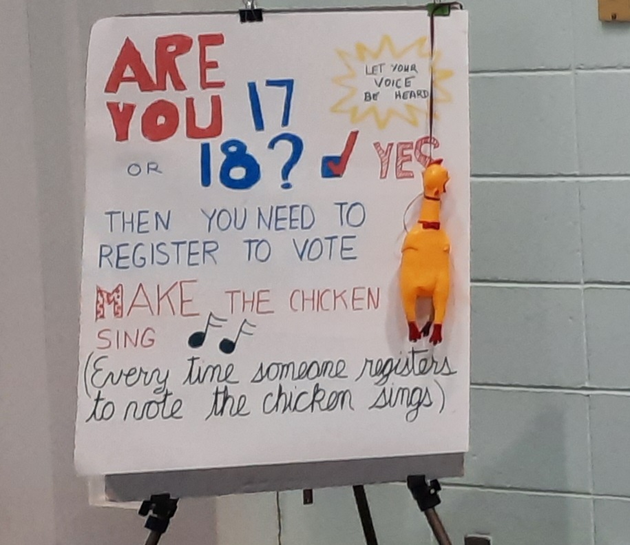 Handmade sign encouraging students to register to vote